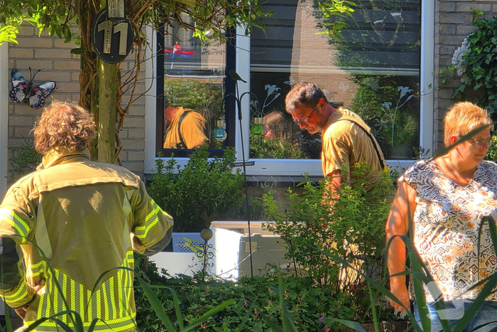 Brandweer blust wasmachinebrand