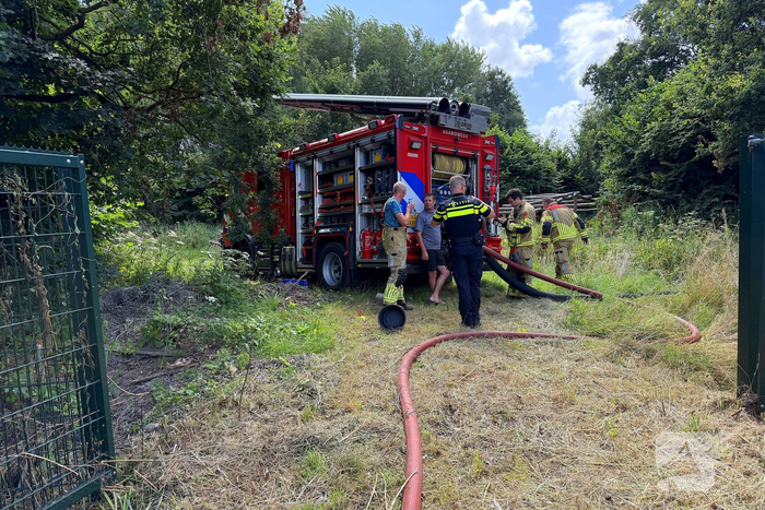 Bosschages in brand nabij treinspoor