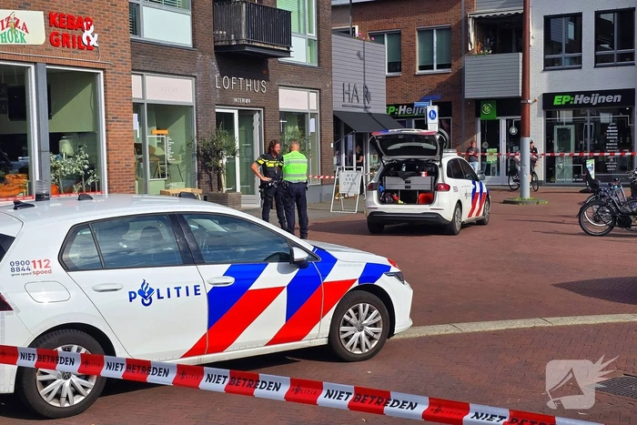 Agenten met kogelwerende vesten ter plaatse