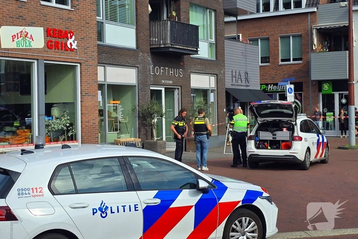 Agenten met kogelwerende vesten ter plaatse