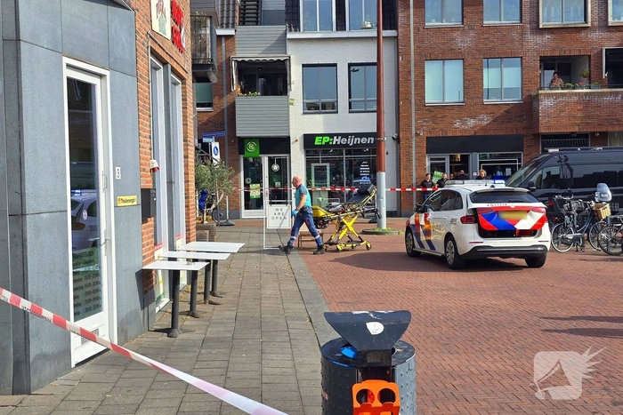 Agenten met kogelwerende vesten ter plaatse