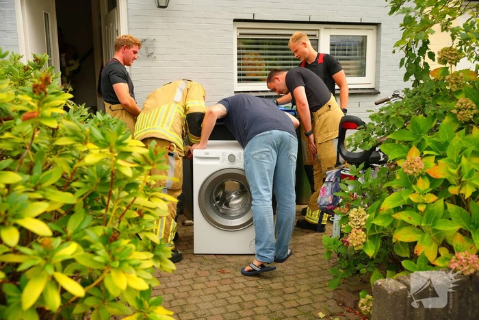 Rookontwikkeling door defecte wasmachine