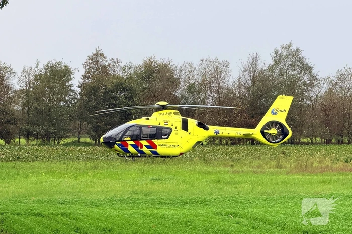 Man bekneld in aardappelrooier