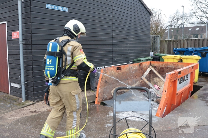 Brand in afvalcontainer bij hockeyvereniging