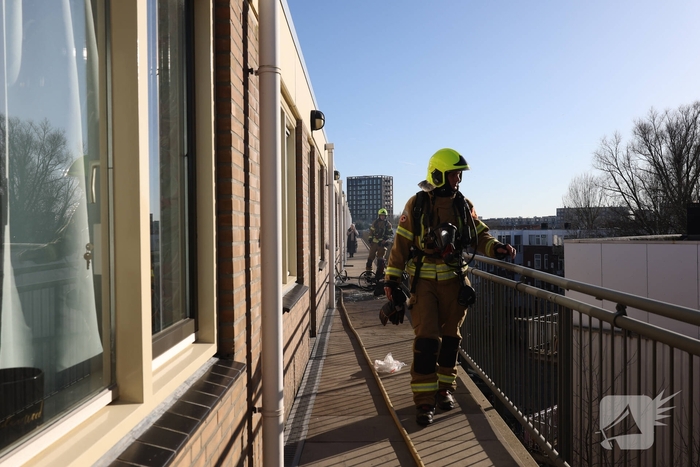 Politie pakt bewoner na woningbrand