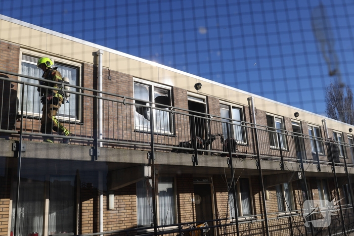 Politie pakt bewoner na woningbrand