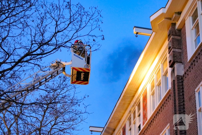 Brand in portiekwoning geblust
