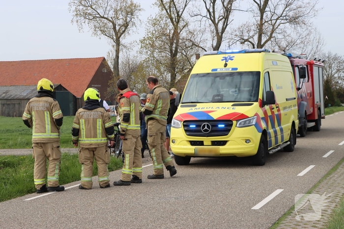 Persoon te water met scootmobiel