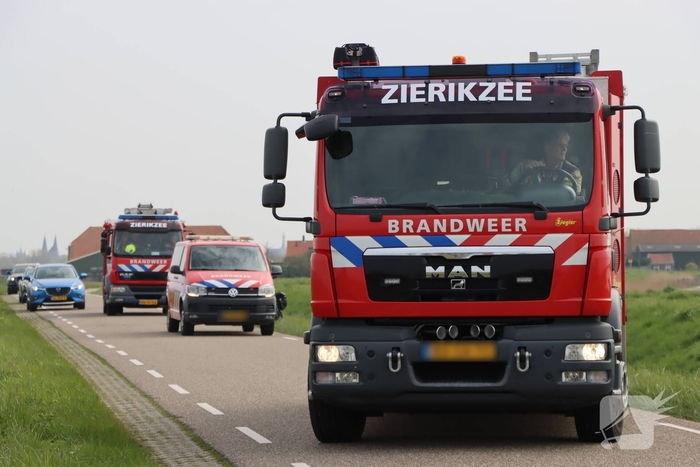 Persoon te water met scootmobiel