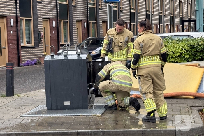 Ondergrondse container in brand