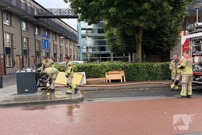 Ondergrondse container in brand
