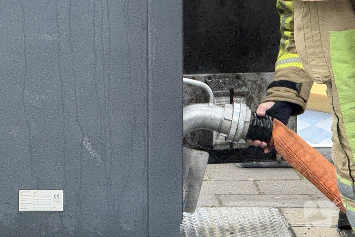 Ondergrondse container in brand