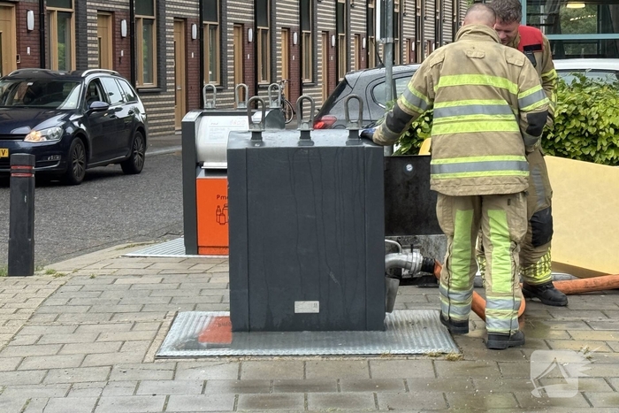 Ondergrondse container in brand
