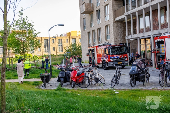 Brand in flat met evacuaties